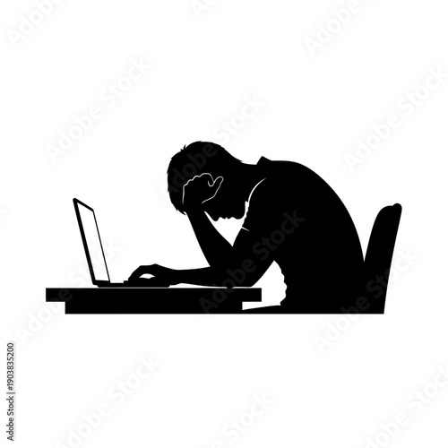 Stressed businessman working on laptop at desk