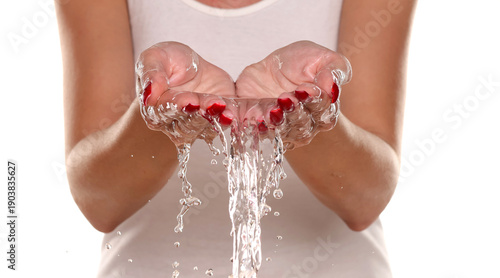 Fotografia Studio shot of a woman’s wet hands after washing, showing hygiene, cleanliness, and gentle daily care routine on white background
