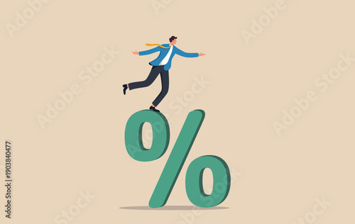 Businessman balancing and running on top of a large green percentage symbol representing financial risk