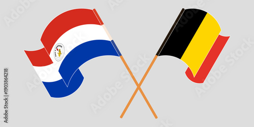 Crossed and waving flags of Republic of Paraguay and Belgium. Vector illustration