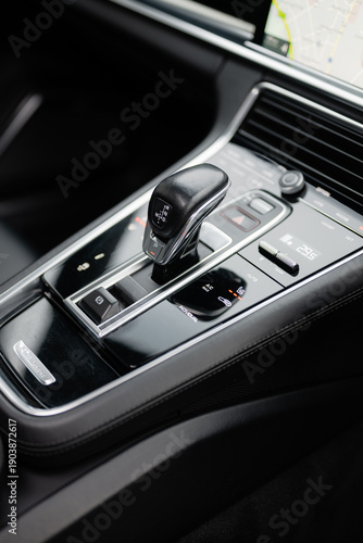 Automatic gear selector shifter on car center console close up