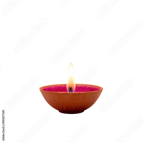 Candle Burning in a Bowl on a Table Creating Light in a Room During Evening H...