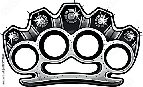 A silver metal knuckle duster with spikes and rivets