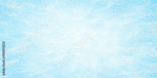 An abstract blue winter wallpaper featuring a cold ice texture and snowflake patterns on a light grunge surface creates a vintage nature backdrop with paint and paper art illustration style