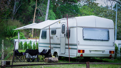 Camping Trailer with Chairs and Awning Set Up