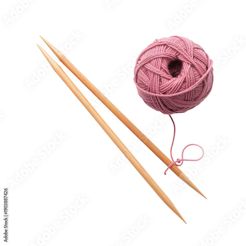 Knitting Tools and Pink Yarn Sit on a Plain Surface Ready for Craft Time in a...