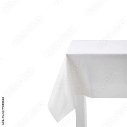 Table With White Tablecloth Set for Meal in Quiet Dining Area With Natural Li...