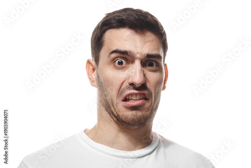 Man with disgusted facial expression showing displeasure and negative emotion