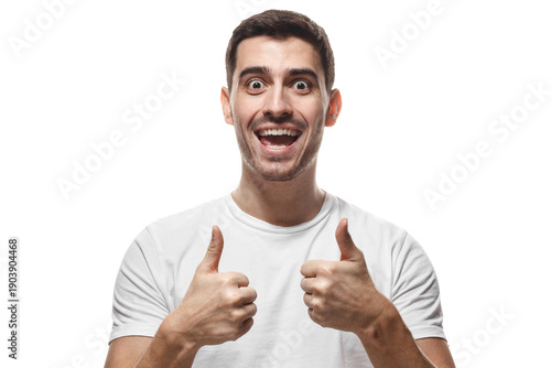 Excited man with open mouth showing enthusiastic double thumbs up gesture