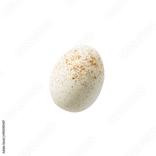 White Egg With Golden Specks Resting on a Plain Surface