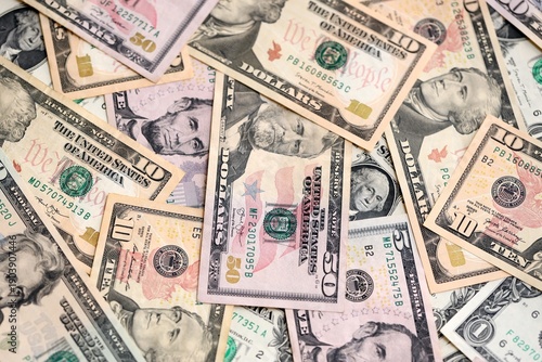 American dollars in one hundred banknotes. Lot of dollars close up. Stack of dollars and cash with a money background.