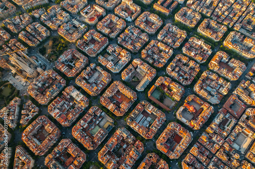 Vászonkép Aerial sunrise view of Barcelona showcasing the Eixample district with its octagonal residential blocks and precise urban grid