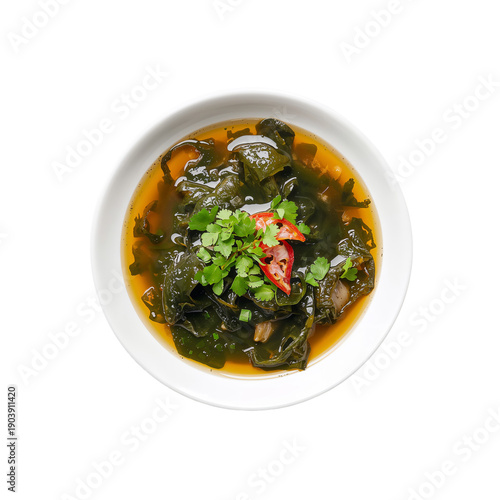 Bowl of Soup With Seaweed, Vegetables, and Herbs Served in a Kitchen During L...