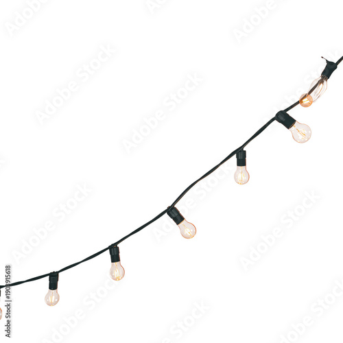 String Lights Hanging on a Black Wire in a Cozy Outdoor Setting During Evenin...