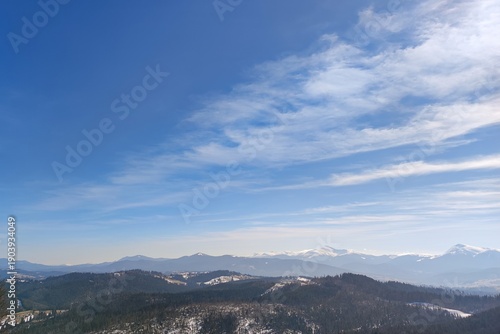 Wide Blue Sky Over Snowy Mountain Peaks with Copy Space