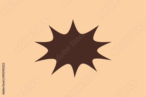 Brown starburst shape on light peach background