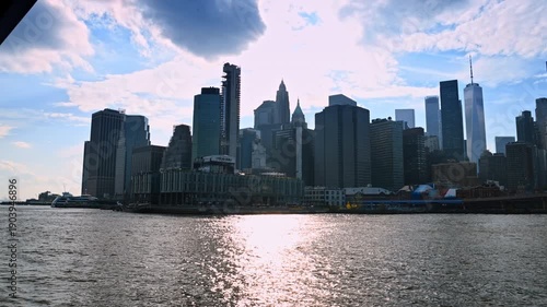 Group of high-rise building standing close to each other. Modern architecture of New York, USA from the East River waterscape.