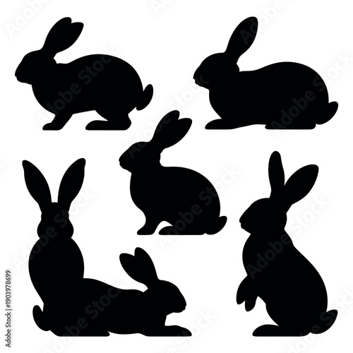 A group of black rabbit silhouettes on white
