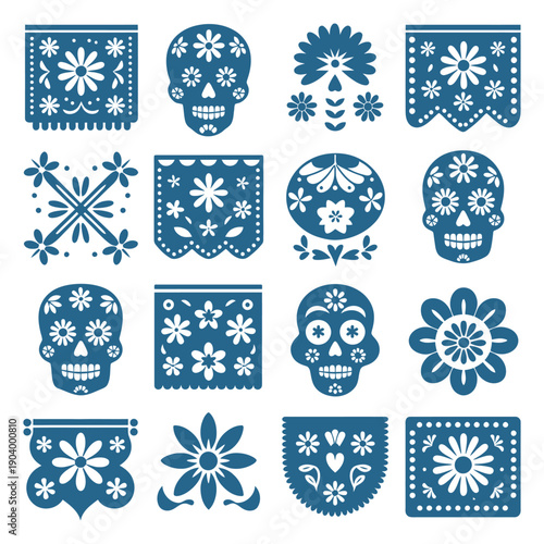 A collection of blue and white paper cutouts for the Day of the Dead, featuring skulls and floral designs.