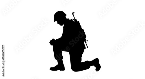 Silhouette of kneeling soldier in uniform.