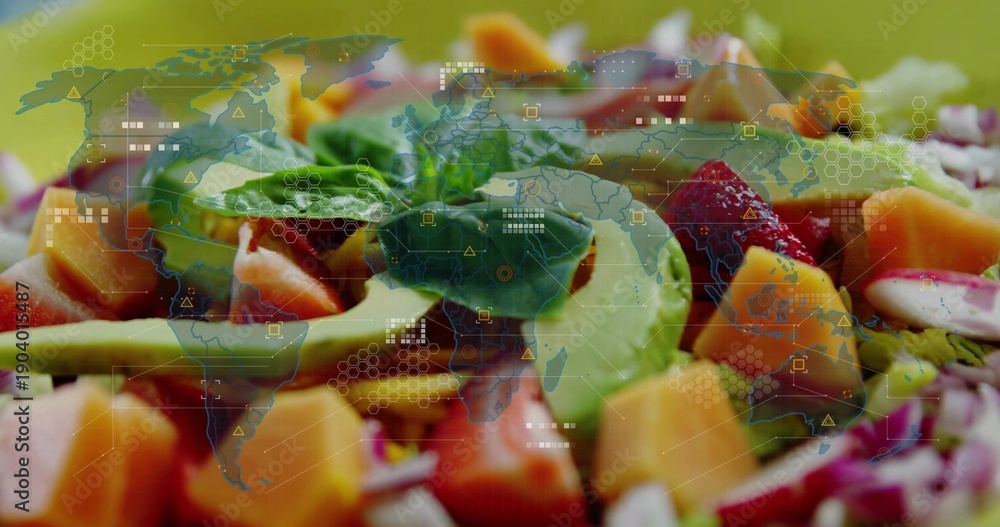 Fototapeta premium Showing colorful salad on shallow bowl at studio table with avocado, mango, strawberry, HUD overlay