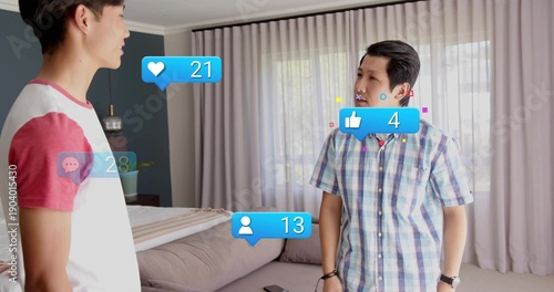 Talking adult, teen males in raglan tee and plaid shirt, standing in bedroom with phone overlays