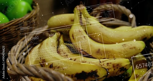 HUD graphics appearing and scanning ripe yellow bananas in woven basket, showing freshness metrics