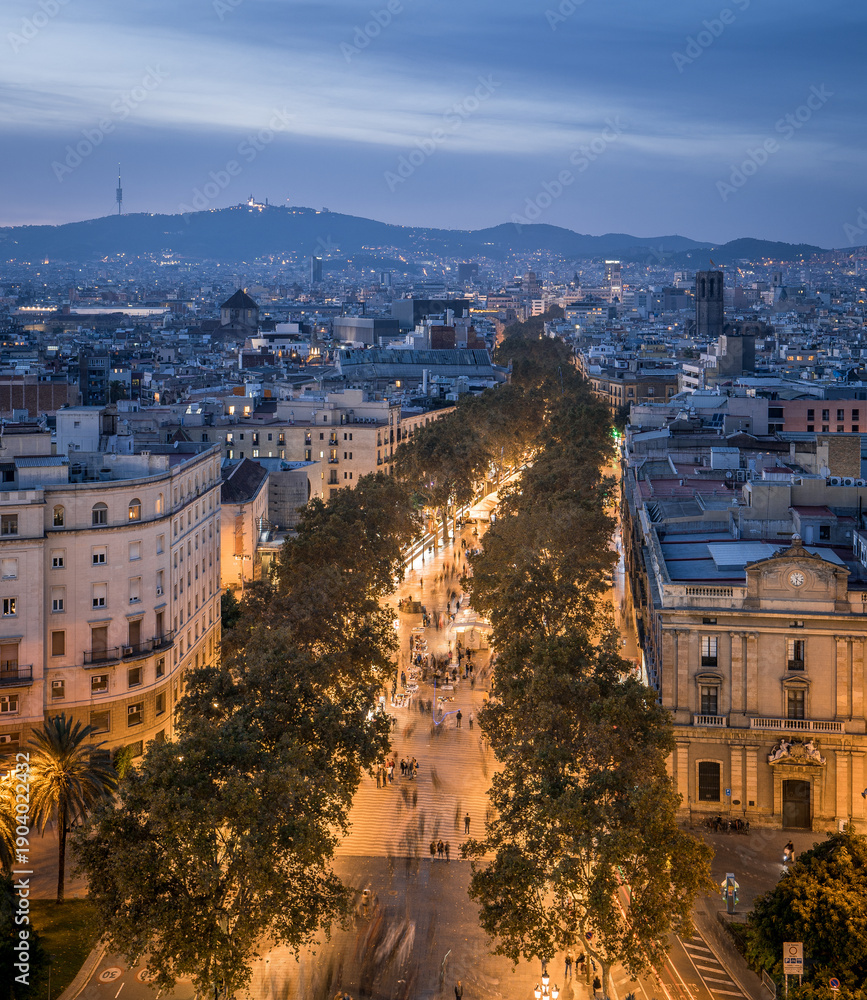 Fototapeta premium Las Ramblas street in Barcelona illuminated at blue hour, Spain