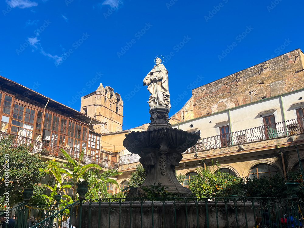 Obraz premium Sicily historic monastery courtyard with fountain statue