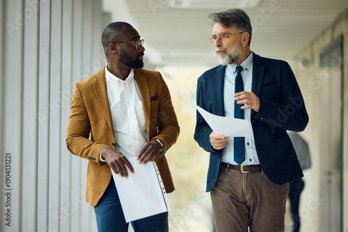Colleagues move through the hallway