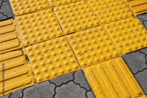 Fotografie Yellow tactile paving for visually impaired