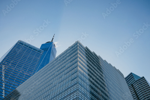 One World Trade Center glass tower with pointed spire and blue sky