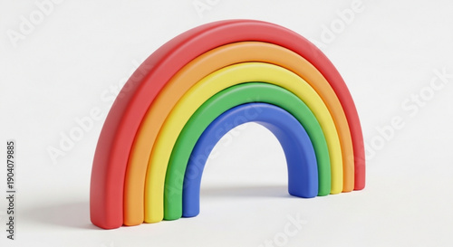 Colorful wooden rainbow toy stacked with multiple curved layers
