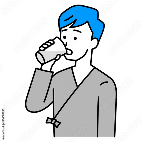 バリウムを飲む検査着の若い男性