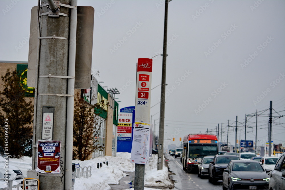 Fototapeta premium Toronto public transport TTC 34 Eglinton East Bus on Eglinton Avenue. Toronto, Ontario, Canada, February 6, 2026: Toronto public transport TTC 34 Eglinton East Bus makes its way along Eglinton Avenue 