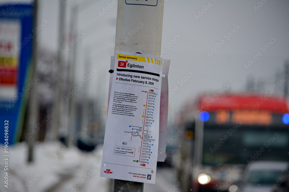 Fototapeta premium Toronto public transport TTC 34 Eglinton East Bus on Eglinton Avenue. Toronto, Ontario, Canada, February 6, 2026: Toronto public transport TTC 34 Eglinton East Bus makes its way along Eglinton Avenue