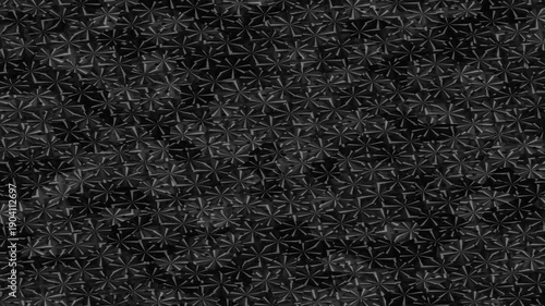 A textured black background featuring a repeating floral pattern