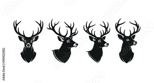 Set of four black silhouette deer heads with antlers.