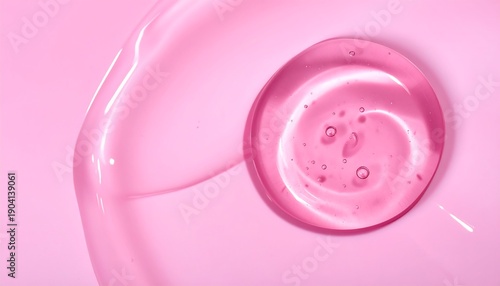 Close-up of a Swirling Pink Gel Droplet on a Pink Background.