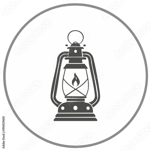 Vintage kerosene lantern with a lit flame inside and metal handle for illumination