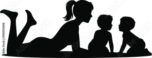 Silhouette of a mother lying down interacting with two young children sitting in front of her on a white background