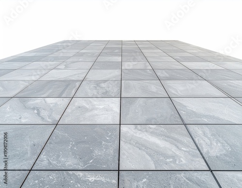 Perspective shot of a tiled, grey surface against a white backdrop