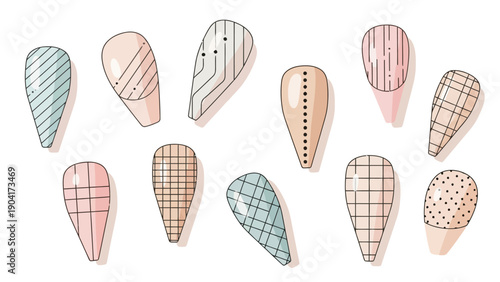 Ten stylized teardropshaped false nails with minimalist geometric designs