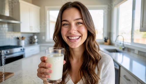 Young woman with glass of milk