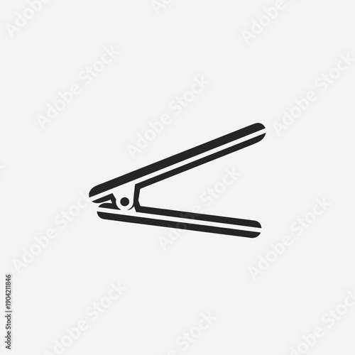 Black outline icon of a staple remover on a plain gray background