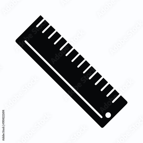 A black ruler with white markings on a white background