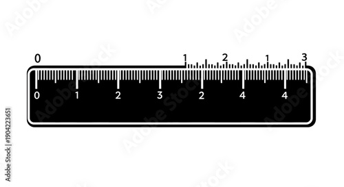 A close-up view of a black metric and imperial ruler with centimeter and inch markings.