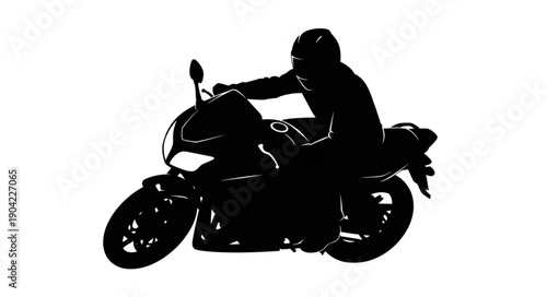 Silhouette of a motorcyclist riding a sport bike.