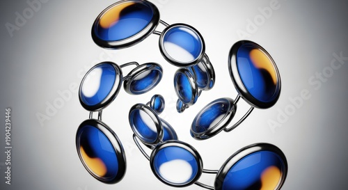 Group of glossy, oval links with blue and amber inserts spiral through an illuminated background.