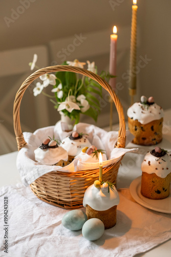Traditional Easter Kulich Cakes with Candles and Decorated Eggs